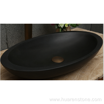 Oval honed natural black lava stone vessel sink